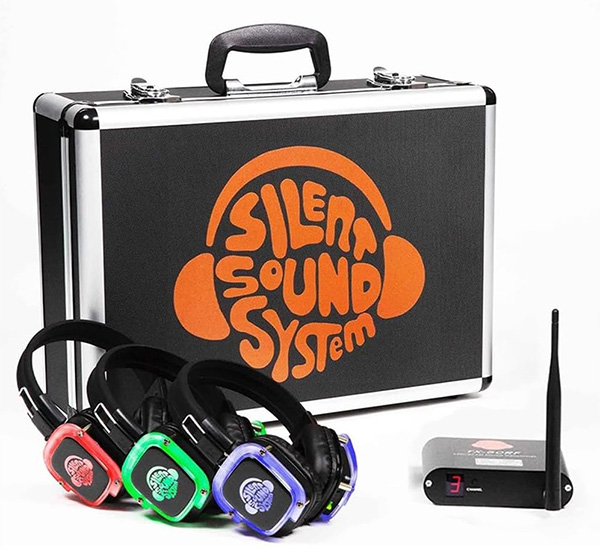 Headphones and a black case that says Silent Sound System on it.