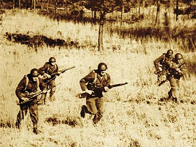 Cover image from Fort Jackson of soldiers running through the grass