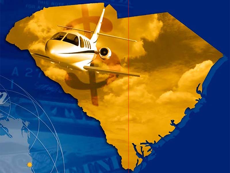South Carolina outline in gold on a blue background with a plane flying in the middle of SC from South Carolina, The Economic Impact of Aviation publication.