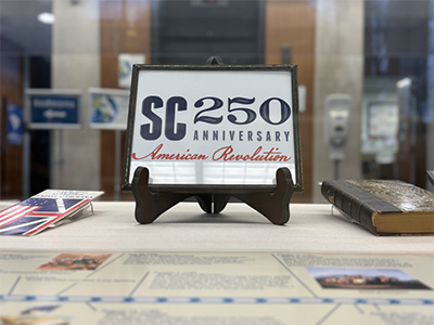 The SC250 logo in a frame in our lobby display.