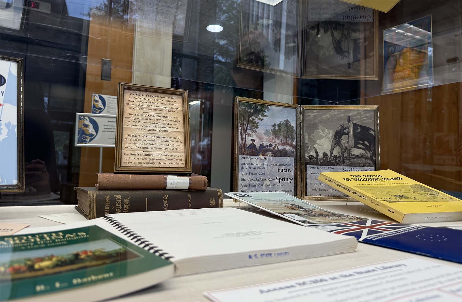 Selection of books in the State Library display case in our lobby.