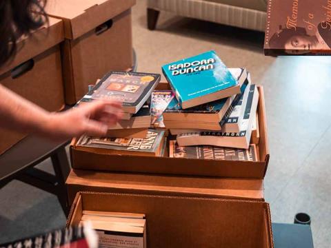Books in a box ready to be shelved.