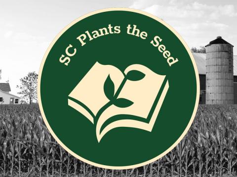 SC Plants the Seed logo over top a black and white image of a farm.