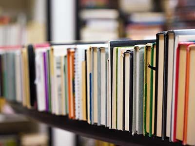 Library books on a library cart.