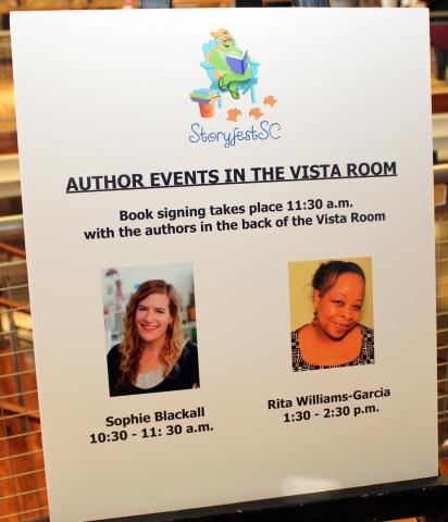 storyfest sign with photos