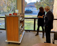 Photo of South Carolina Governor Henry McMaster Viewing book collection at the John de la Howe School. 