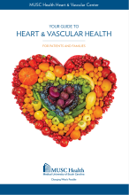The cover of the MUSC Guide to Heart and Vascular Health shows rainbow-ordered fruits and vegetables arranged in a heart shape.. 